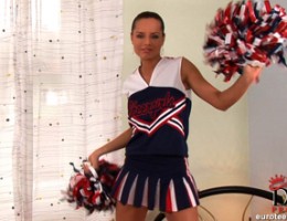 Sexy cheerleader Kari stripping naked on bed showing pussy