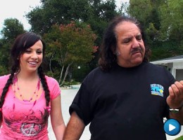 Sassy little brunette slut struts Ron Jeremy donw the street and fucks him
